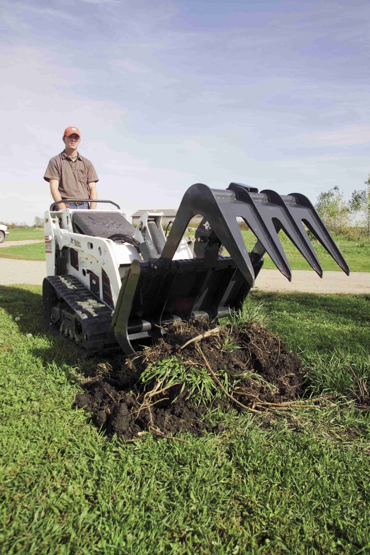 Bobcat mini tracked loader mt55 grapple root landscaping 71319 33261 071004 scaled 1 Bobcat mini tracked loader mt55 grapple root landscaping 71319 33261 071004 scaled 1